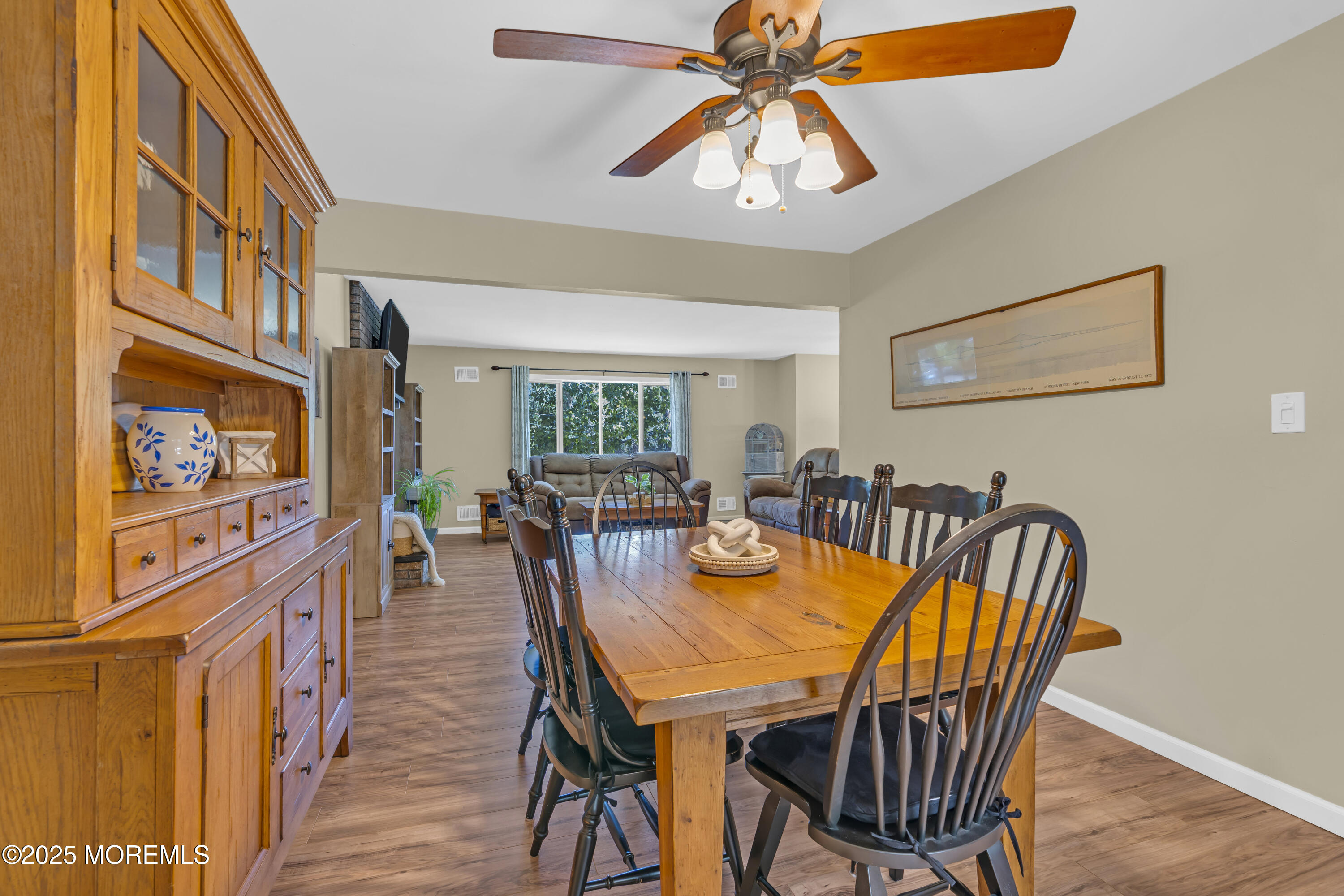 910 Woodlane Road Jackson, NJ 08527 - Photo 12 of 36 a view of a a dining room with furniture window and wooden floor