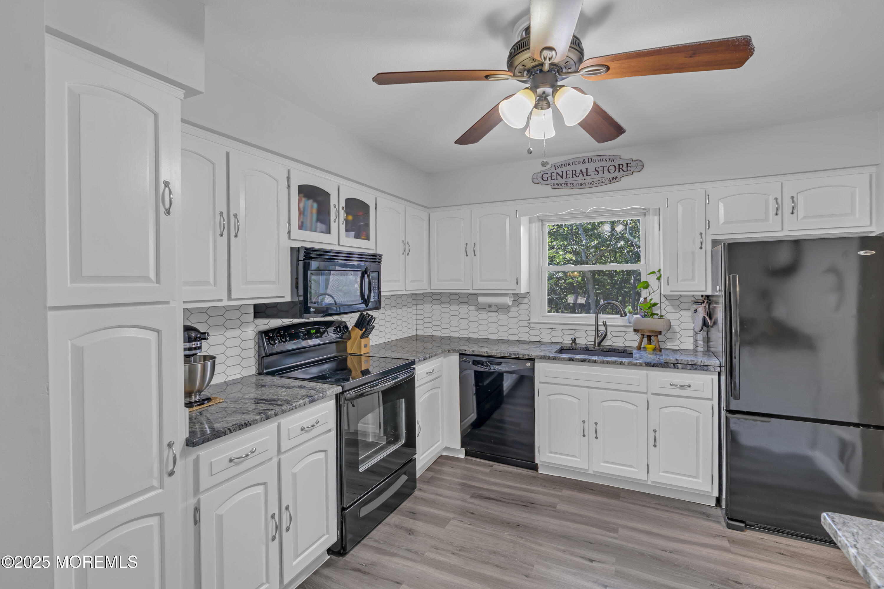 910 Woodlane Road Jackson, NJ 08527 - Photo 15 of 36 a kitchen with stainless steel appliances granite countertop a stove sink and refrigerator