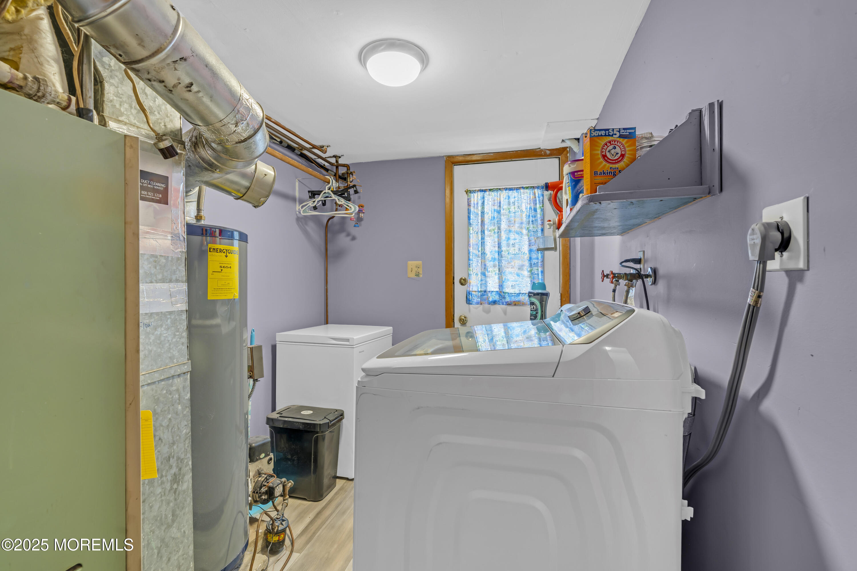 910 Woodlane Road Jackson, NJ 08527 - Photo 26 of 36 a living room with furniture and a window