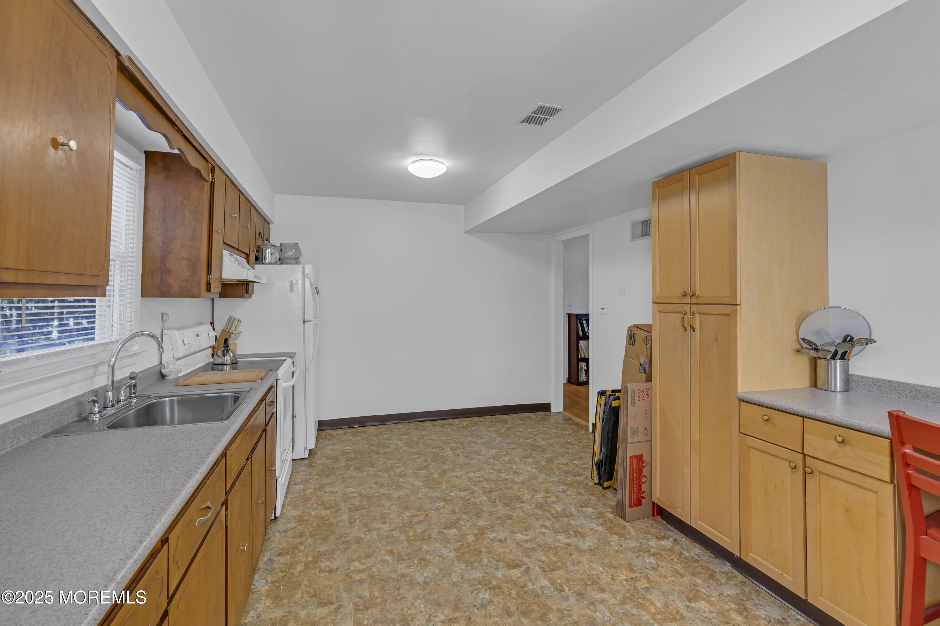 910 Woodlane Road Jackson, NJ 08527 - Photo 30 of 36 a view of a kitchen cabinets and a sink
