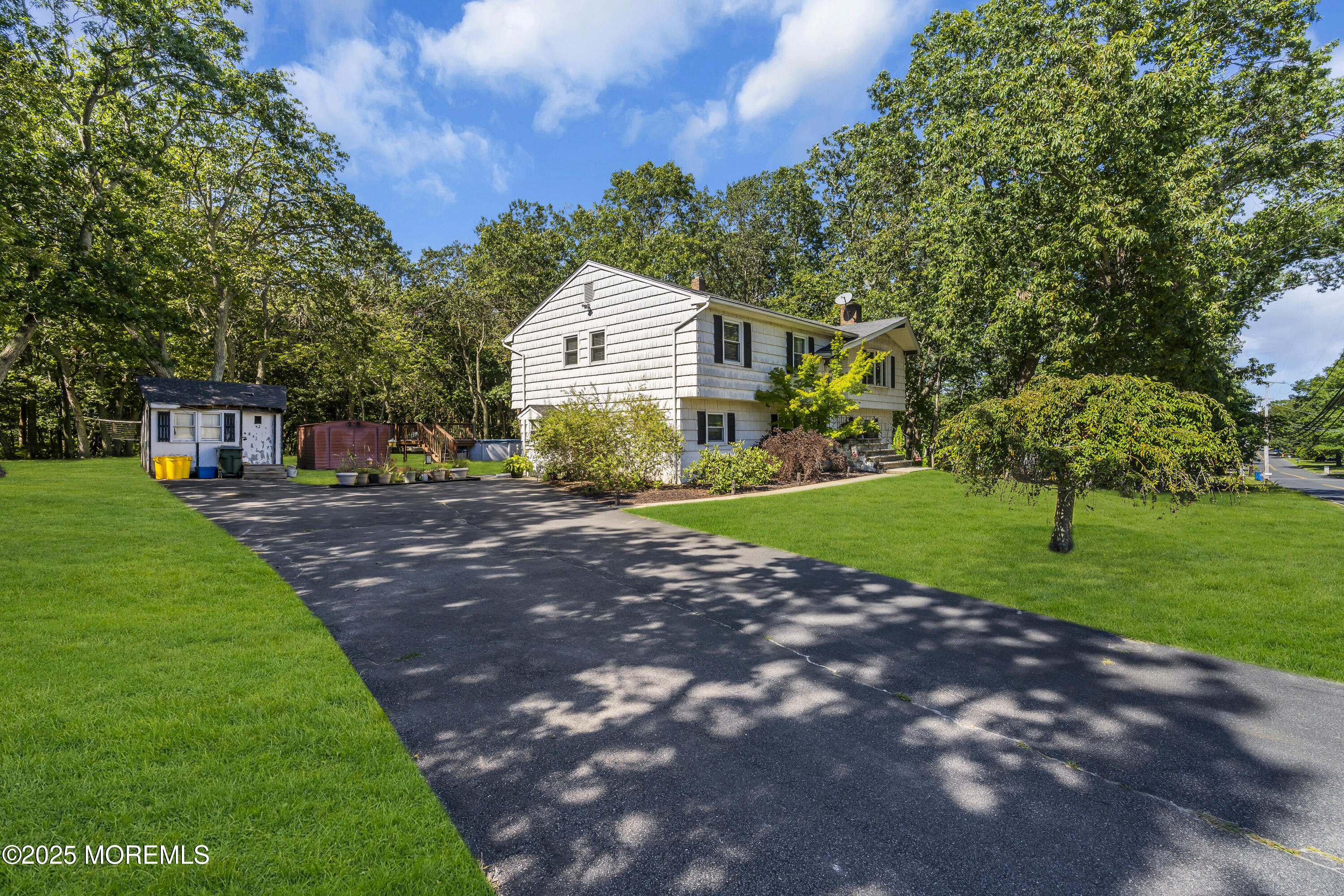 910 Woodlane Road Jackson, NJ 08527 - Photo 3 of 36 a front view of a house with a yard