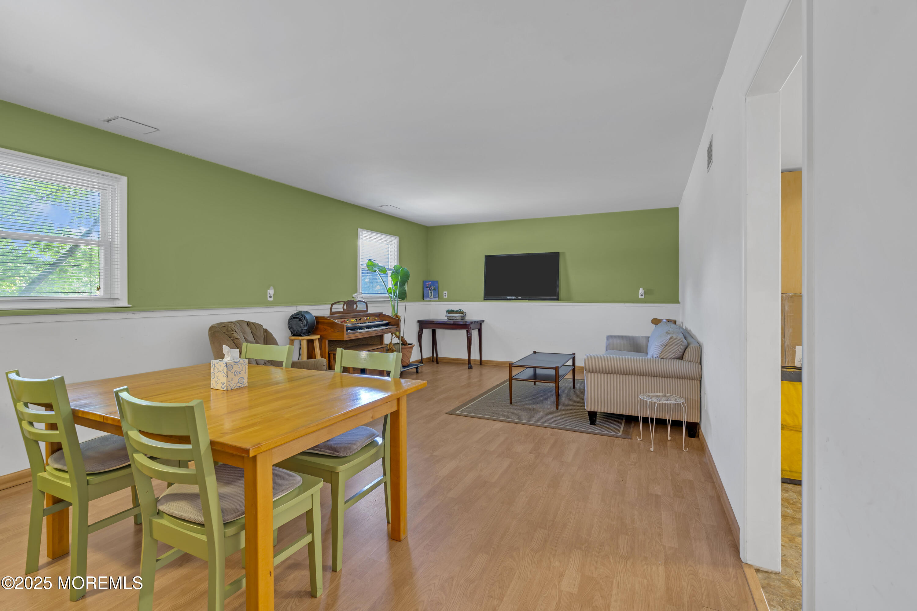 910 Woodlane Road Jackson, NJ 08527 - Photo 31 of 36 a view of a dining room with furniture and a wooden floor