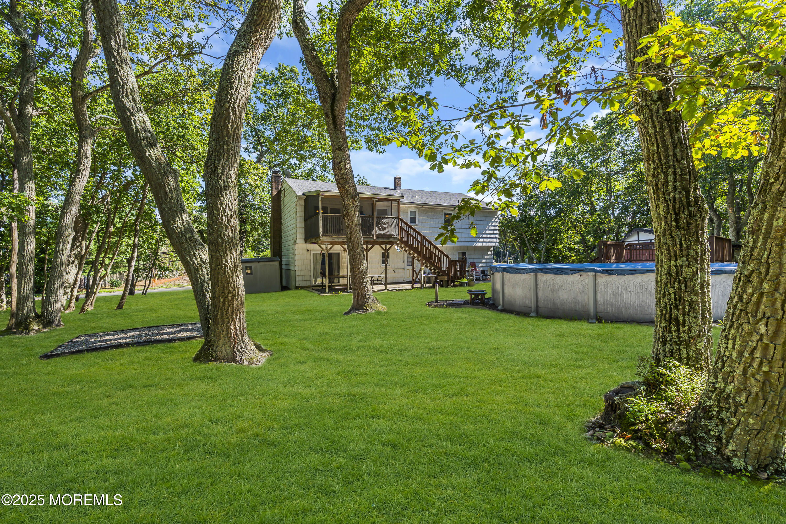 910 Woodlane Road Jackson, NJ 08527 - Photo 35 of 36 a view of a house with a park
