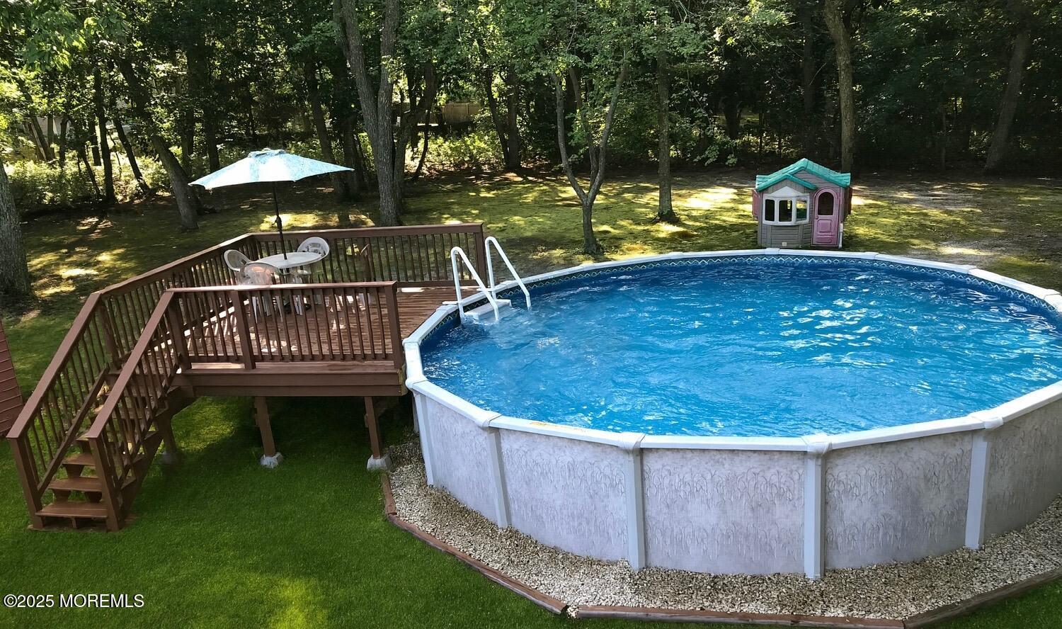 910 Woodlane Road Jackson, NJ 08527 - Photo 36 of 36 a view of a wooden deck with chairs