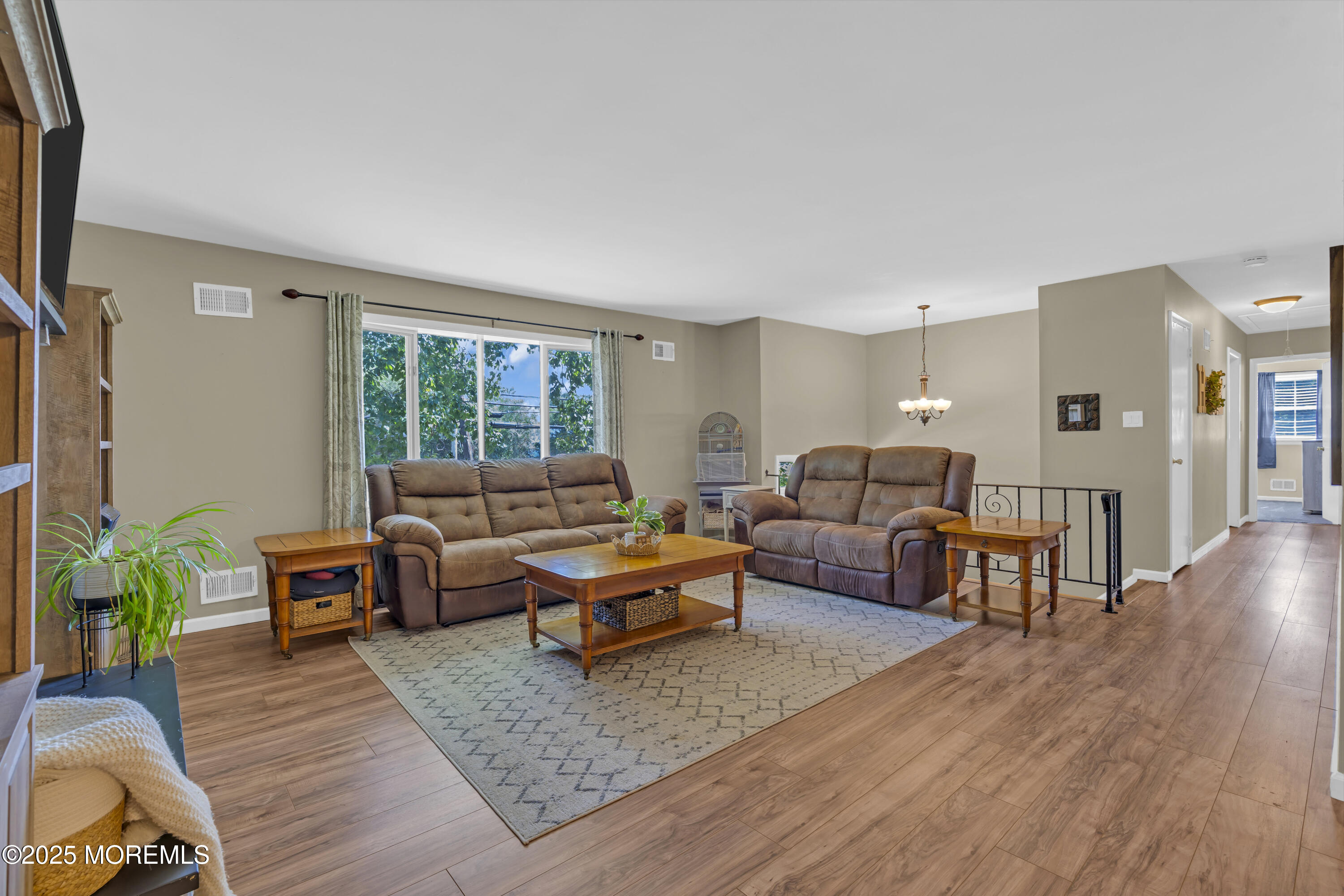 910 Woodlane Road Jackson, NJ 08527 - Photo 5 of 36 a living room with furniture and a large window