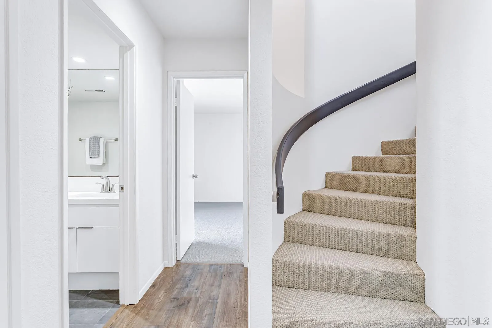 1031 Reliance Way Del Mar, CA 92014 - Photo 17 of 33 a living room with furniture and stairs