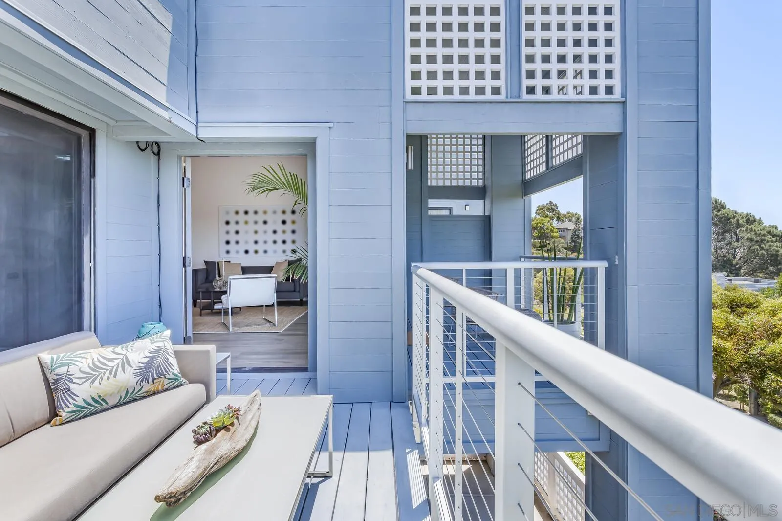 1031 Reliance Way Del Mar, CA 92014 - Photo 24 of 33 a living room with furniture and a wooden floor