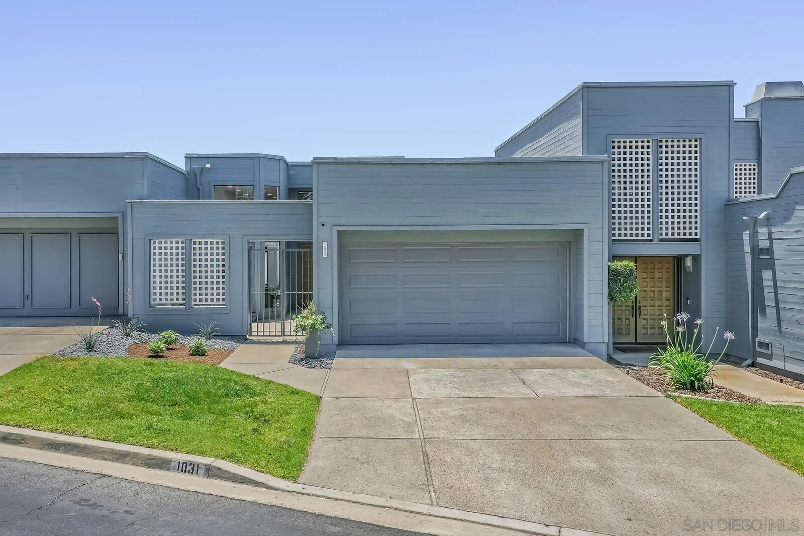 1031 Reliance Way Del Mar, CA 92014 - Photo 3 of 33 a front view of a house with a garden and plants