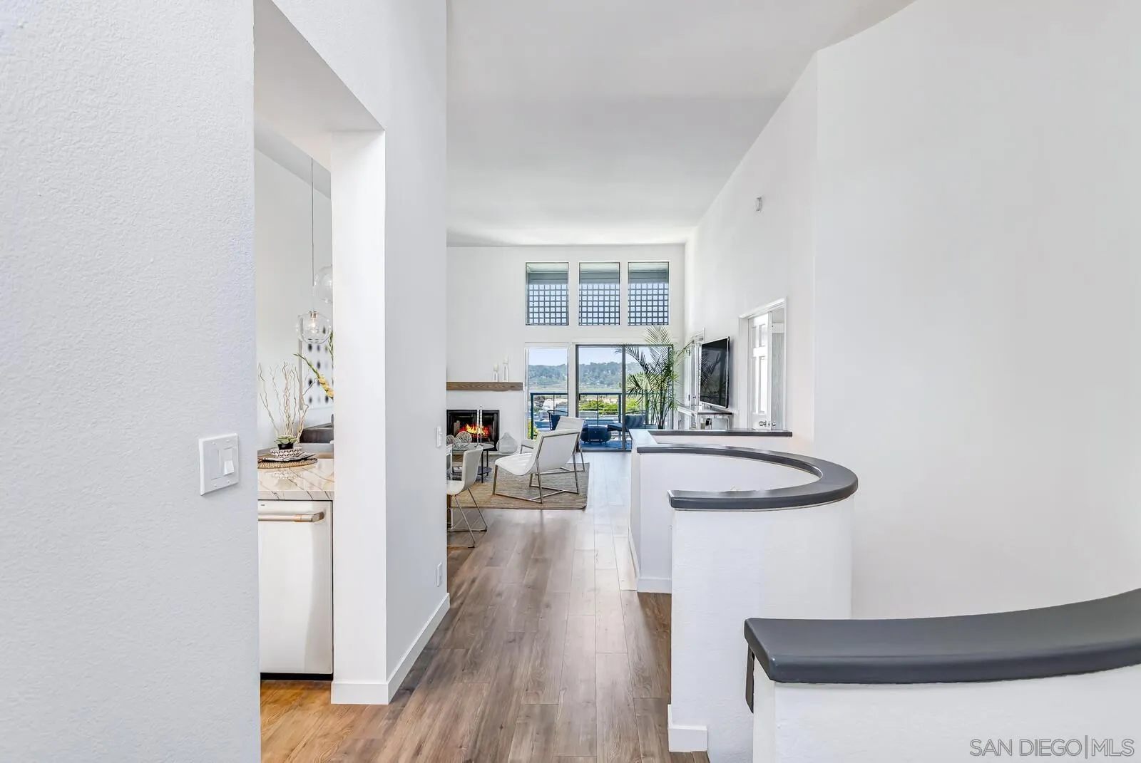 1031 Reliance Way Del Mar, CA 92014 - Photo 5 of 33 a kitchen with sink cabinets and wooden floor