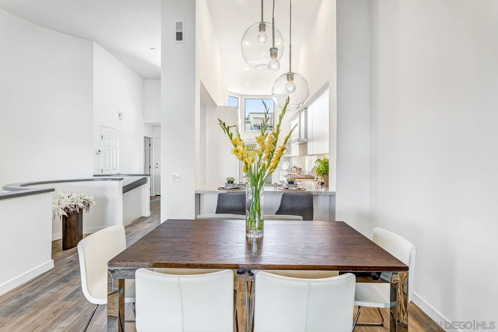1031 Reliance Way Del Mar, CA 92014 - Photo 8 of 33 a view of a dining room with furniture and wooden floor