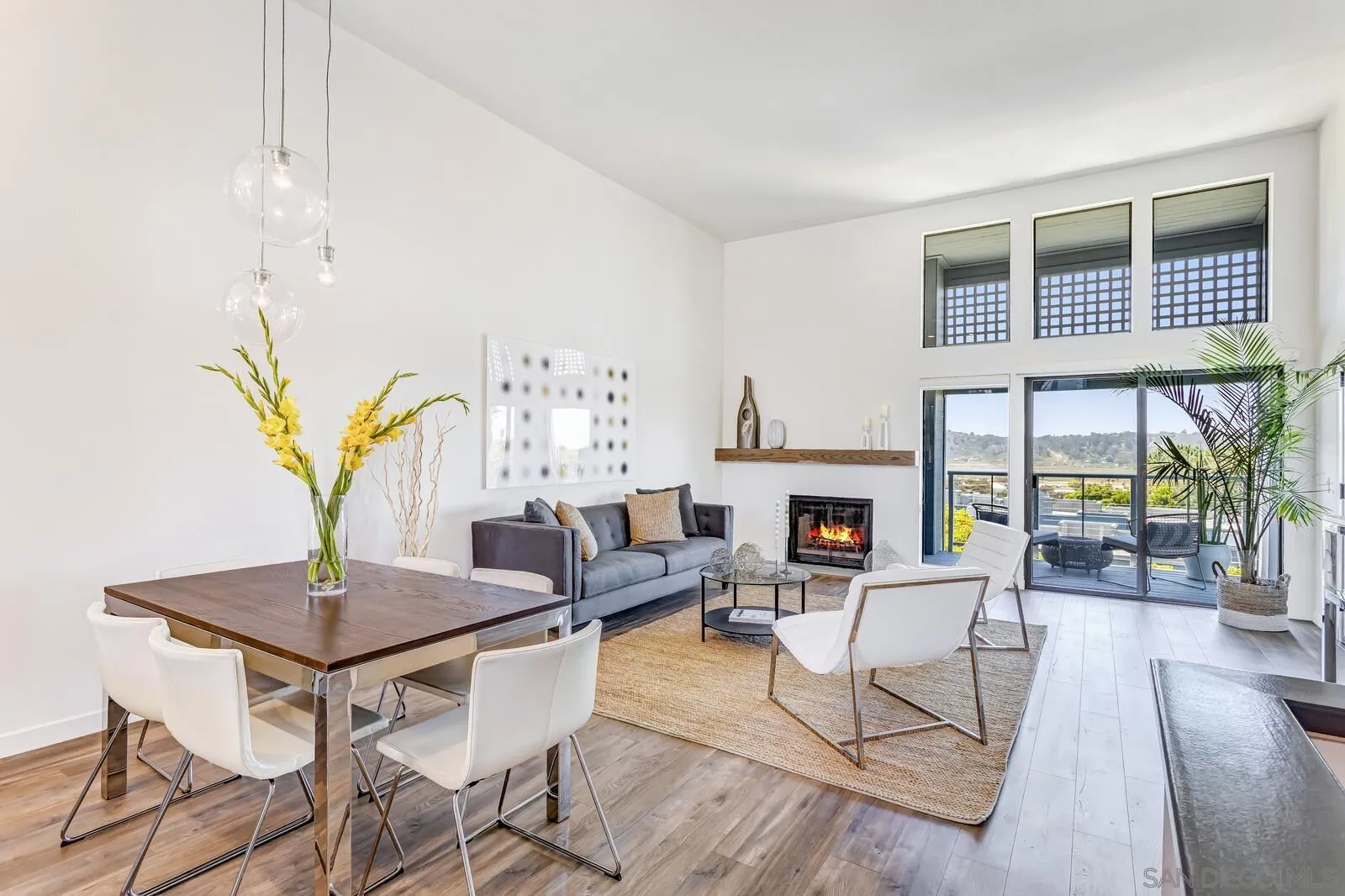 1031 Reliance Way Del Mar, CA 92014 - Photo 9 of 33 a living room with fireplace furniture and a window