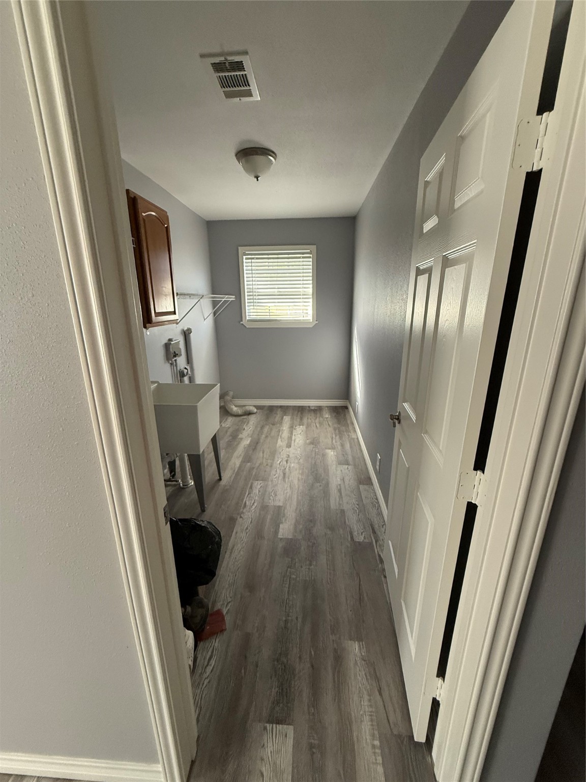 211 North Frances Avenue Shepherd, TX 77371 - Photo 9 of 11 a view of a livingroom with wooden floor and staircase