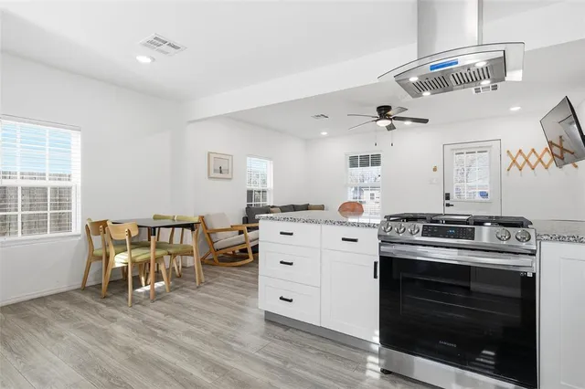 a view of a dining room with furniture and window