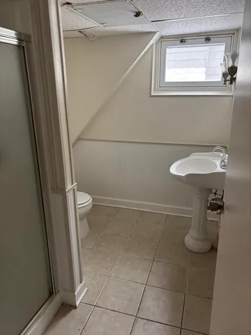 a bathroom with a sink and toilet