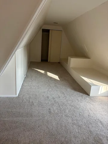 a view of a big room with an entryway