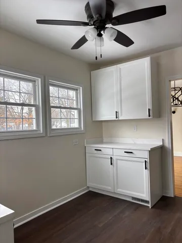 a view of cabinets and window
