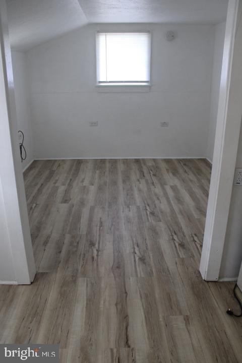 28 East Maple Street Dallastown, PA 17313 - Photo 5 of 7 an empty room with wooden floor and windows