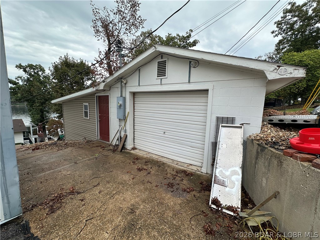 33060 Fairglen Road Sunrise Beach, MO 65079 - Photo 11 of 37 Another single car garage with shop