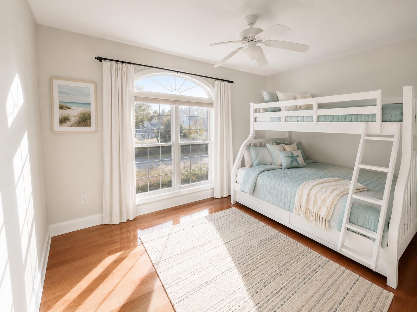 147 Dover Lane Freeport, FL 32439 - Photo 12 of 27 a bedroom with a large bed and a chandelier