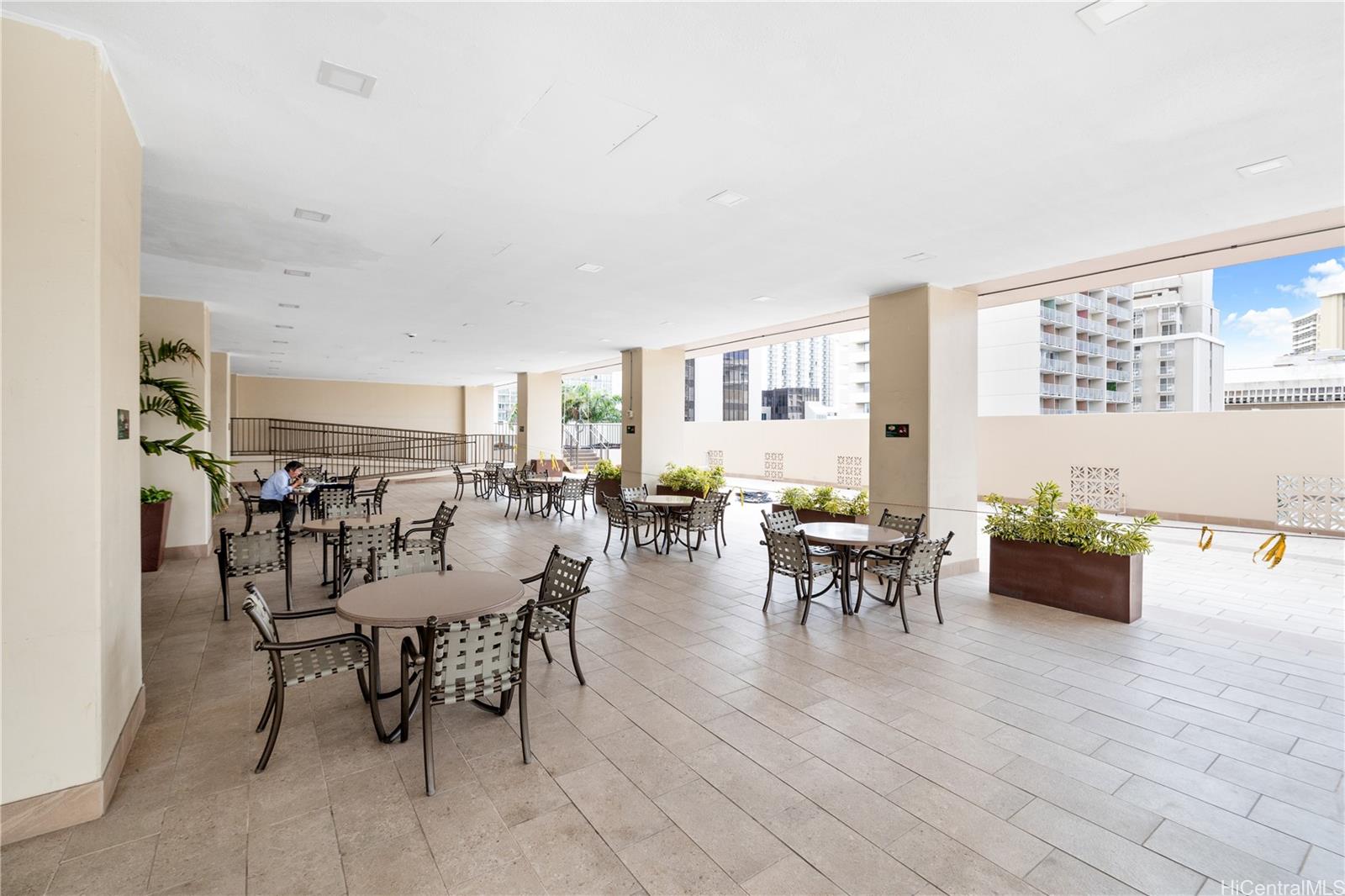 2240 Kūhiō Avenue, Unit 2308 Honolulu, HI 96815 - Photo 13 of 21 a view of a dining room with furniture and wooden floor