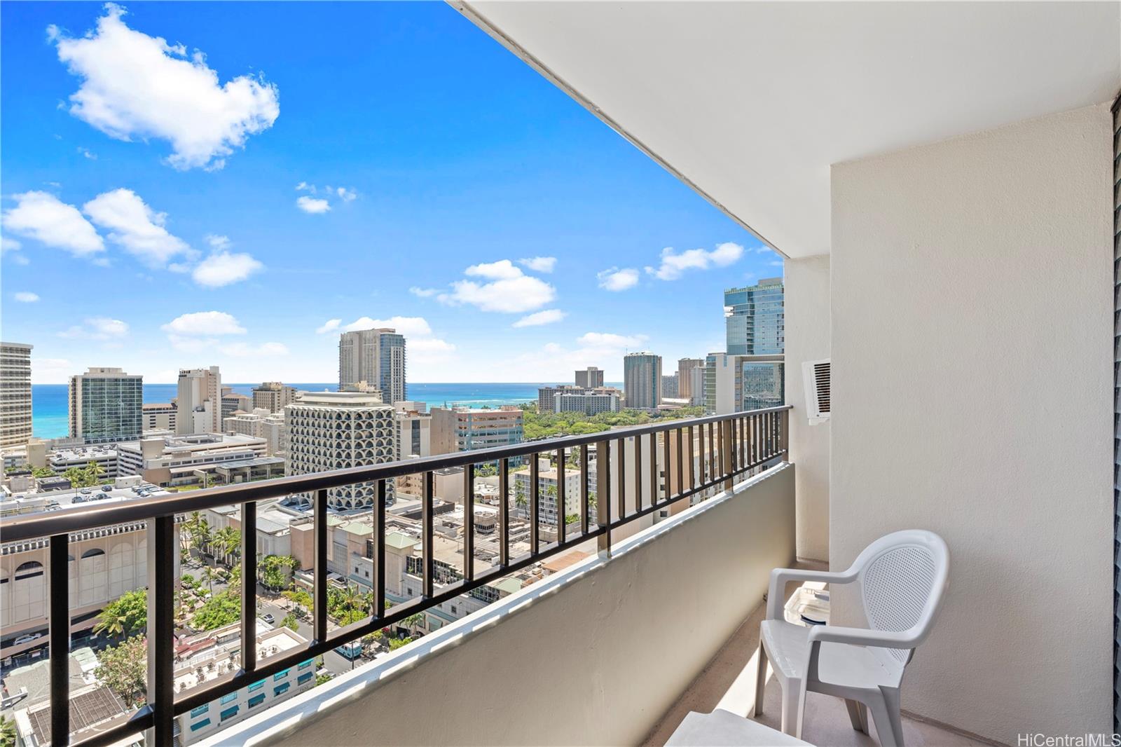 2240 Kūhiō Avenue, Unit 2308 Honolulu, HI 96815 - Photo 4 of 21 a view of a chair and tables in the balcony