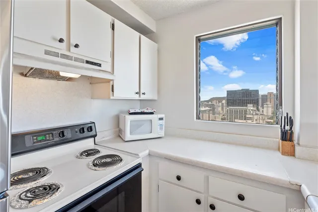 a kitchen with a stove and a refrigerator