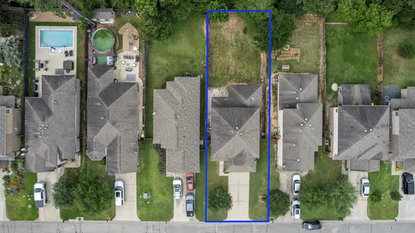 aerial view of a house with a garden