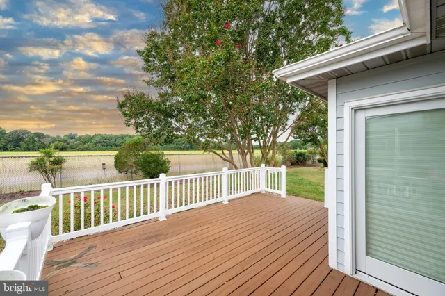 a view of a wooden deck and a yard