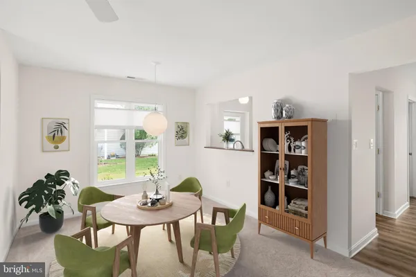 a view of a livingroom with furniture and window