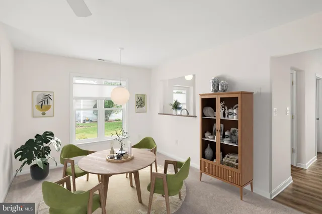 a view of a livingroom with furniture and window