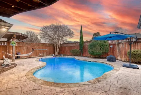 a view of a chairs and table in the patio