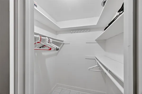 a view of storage and utility room with racks on the wall