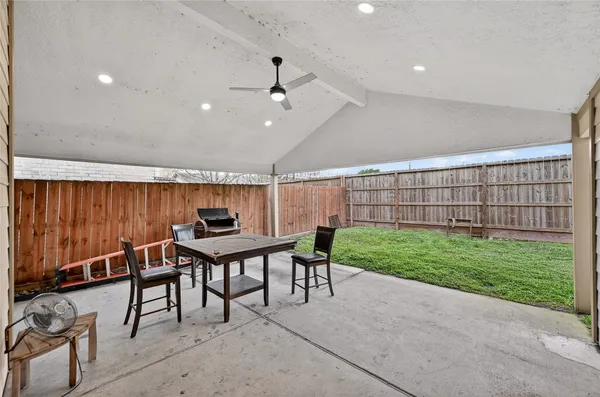 a view of a patio with furniture