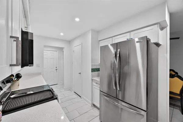 a walk in closet with a couch