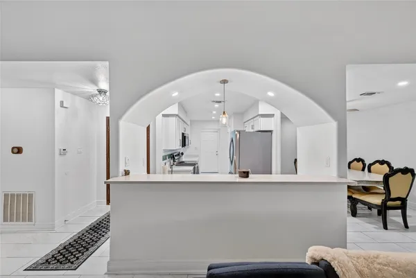 a view of a living room and bedroom with furniture