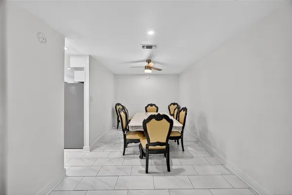 a work room with furniture and chandelier