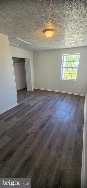 2911 Browns Store Road, Unit 5 Heathsville, VA 22473 - Photo 2 of 3 an empty room with wooden floor and windows