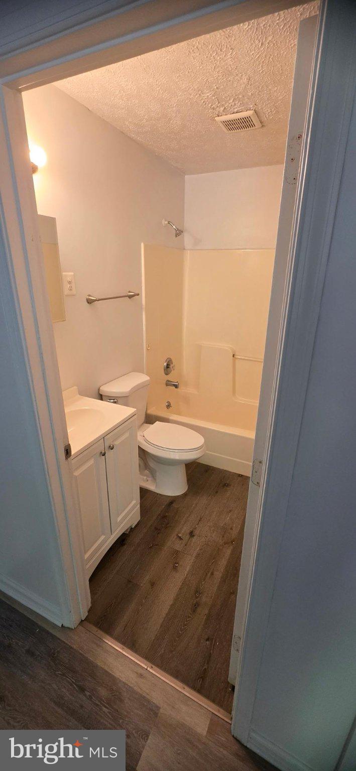 2911 Browns Store Road, Unit 5 Heathsville, VA 22473 - Photo 3 of 3 a bathroom with a sink a toilet and a window