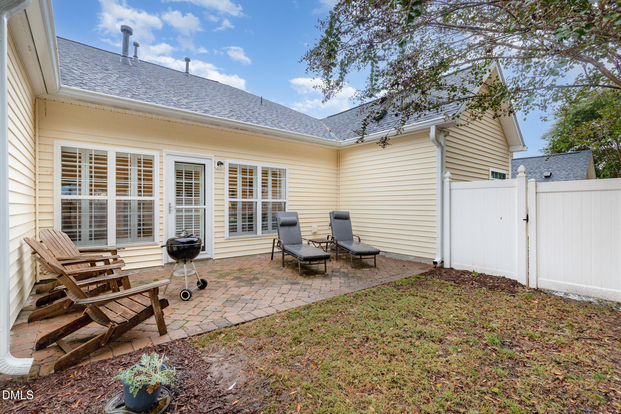 2541 Forest Shadows Lane Raleigh, NC 27614 - Photo 22 of 23 a backyard of a house with seating space