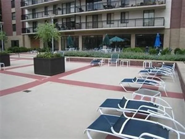 a view of a building with balcony and patio