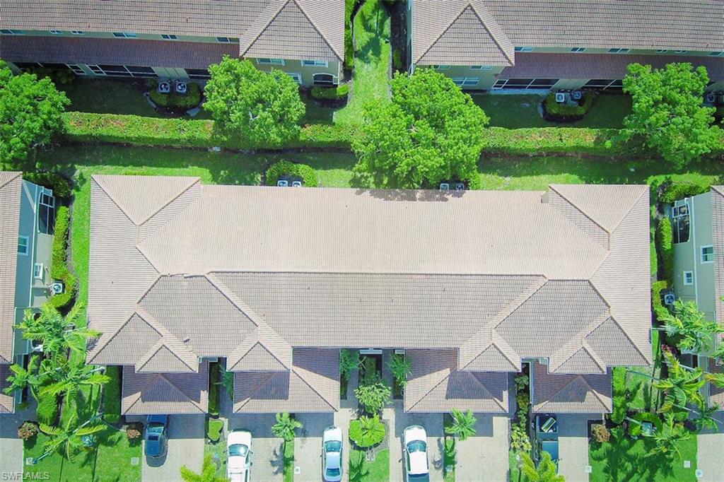 an aerial view of house with yard