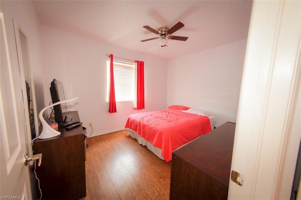 17537 Cherry Ridge Lane Fort Myers, FL 33967 - Photo 16 of 20 a bedroom with a bed and a window