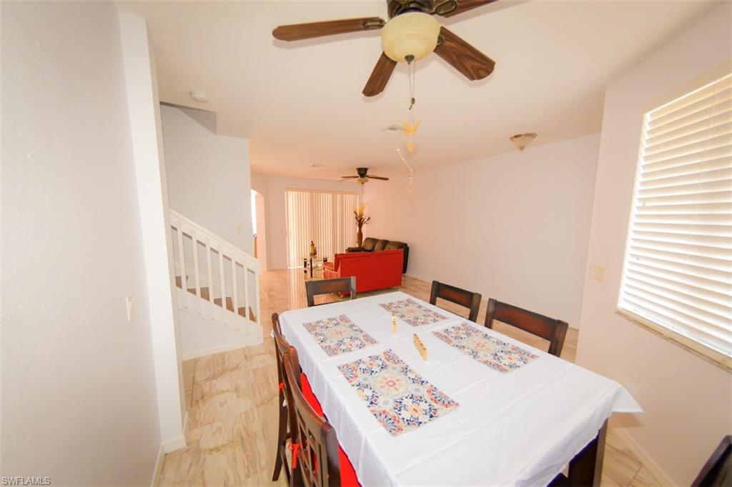 17537 Cherry Ridge Lane Fort Myers, FL 33967 - Photo 19 of 20 a view of a dining table and chairs in a room