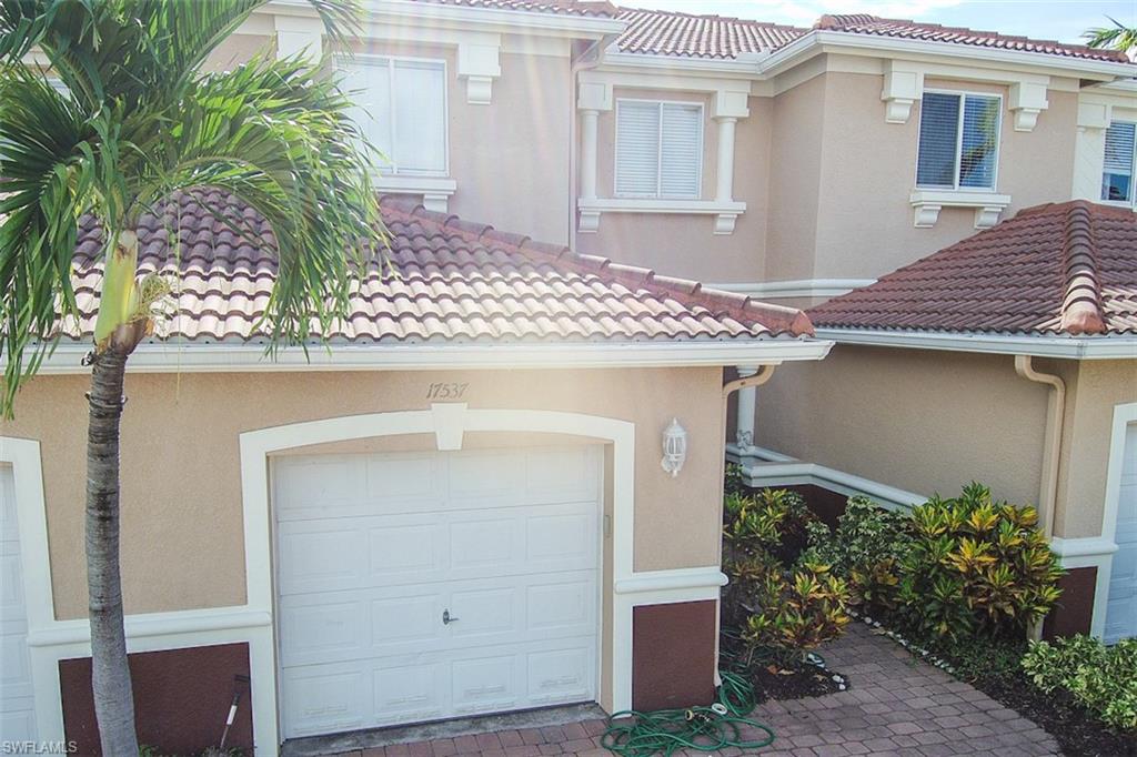 17537 Cherry Ridge Lane Fort Myers, FL 33967 - Photo 20 of 20 a front view of a house with plants