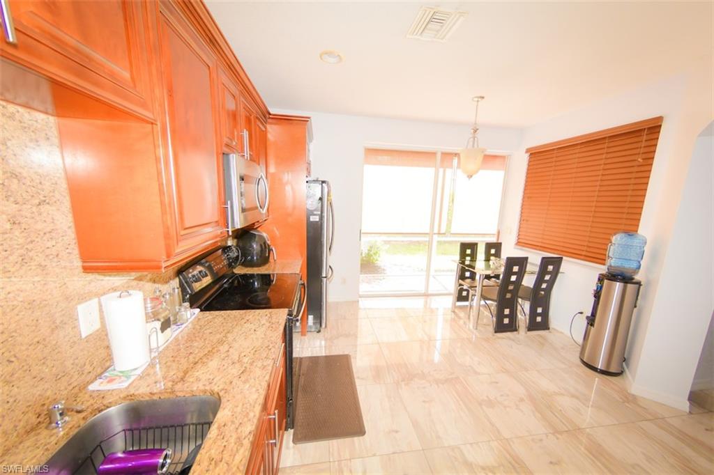 17537 Cherry Ridge Lane Fort Myers, FL 33967 - Photo 6 of 20 a view of a living room and a balcony
