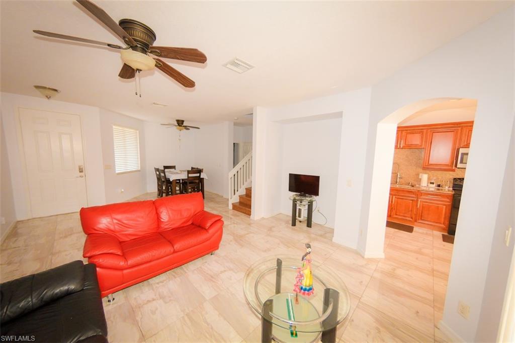 17537 Cherry Ridge Lane Fort Myers, FL 33967 - Photo 8 of 20 a living room with blue lights with furniture