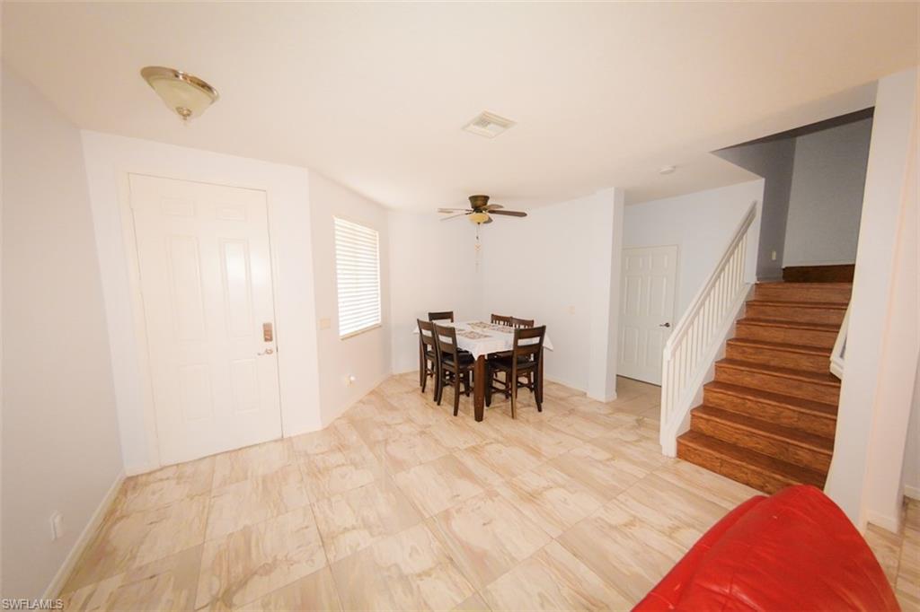 17537 Cherry Ridge Lane Fort Myers, FL 33967 - Photo 9 of 20 a view of dining room with furniture and a chandelier