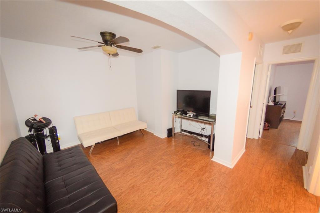 17537 Cherry Ridge Lane Fort Myers, FL 33967 - Photo 10 of 20 a living room with furniture and a flat screen tv