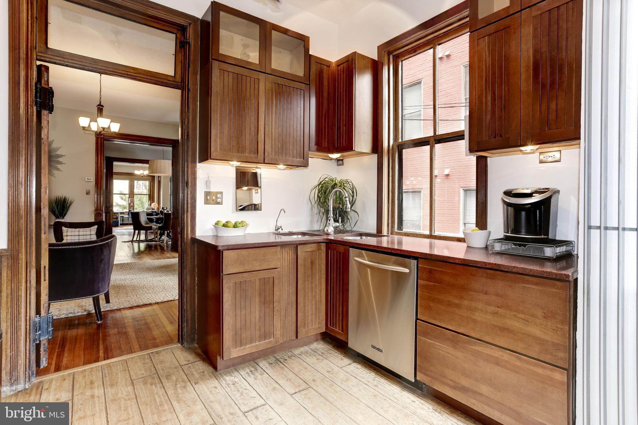 1410 15th Street Northwest Washington, DC 20005 - Photo 17 of 50 Granite, stainless steel appliances, and skylight
