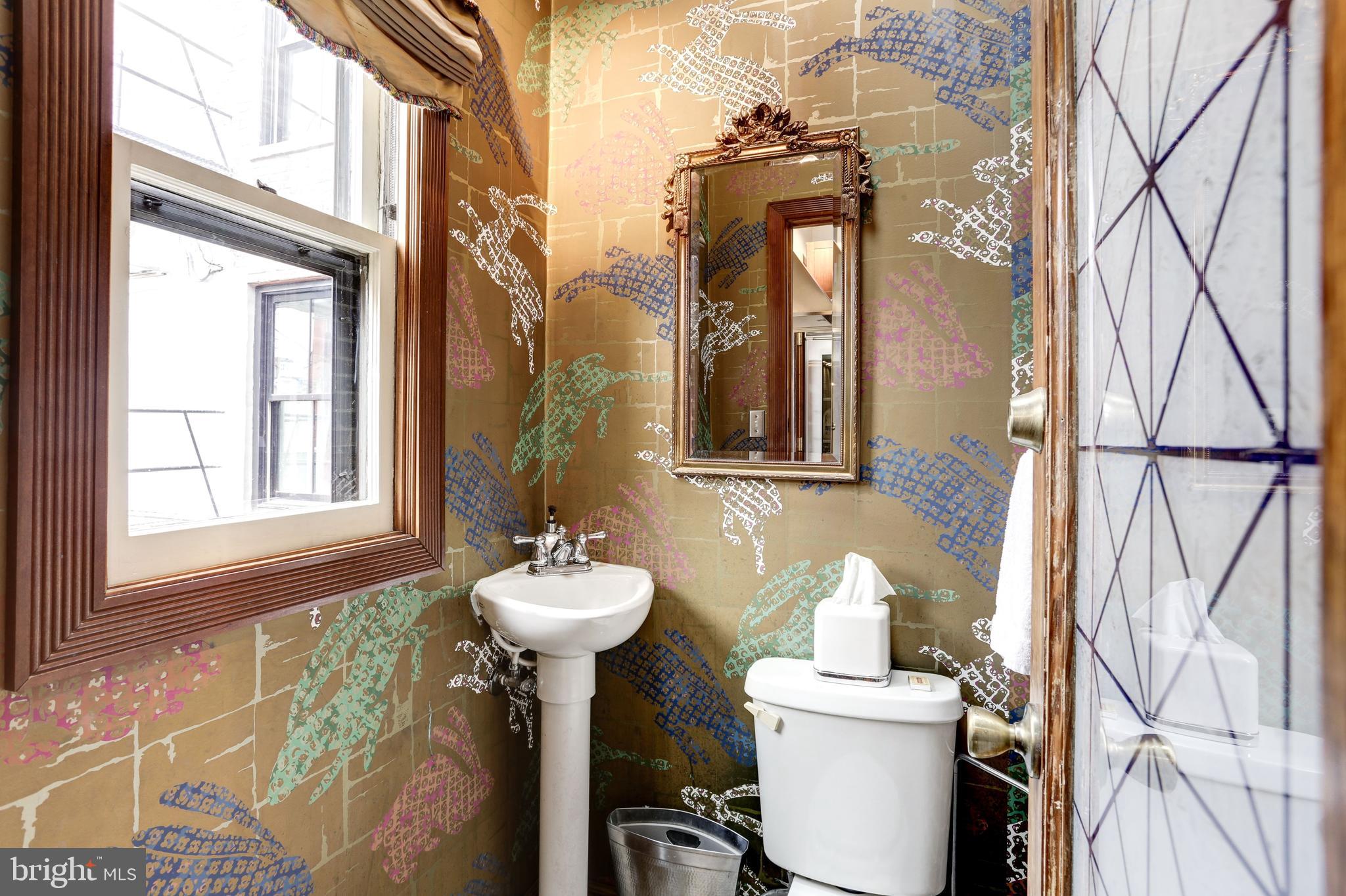 1410 15th Street Northwest Washington, DC 20005 - Photo 18 of 50 Half bath off of kitchen with skylight and window.